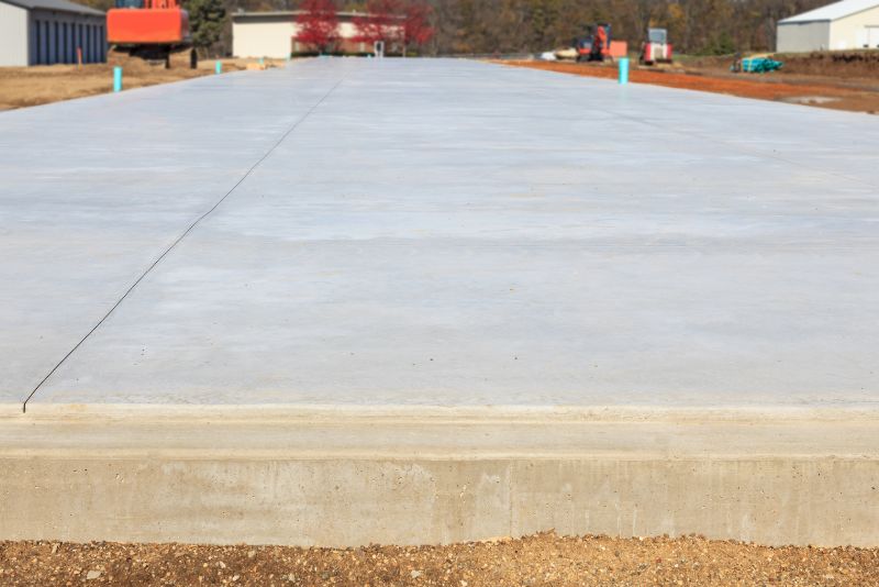 Concreter hand-troweling a smooth finish onto fresh concrete