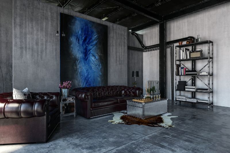 Dark polished concrete floor in a furnished industrial-style living room